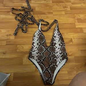 Sexy snake wrapped around one piece!